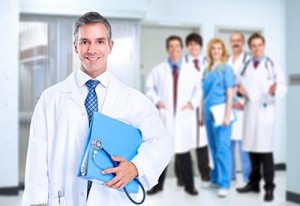 Smiling family doctor with stethoscope. Health care.