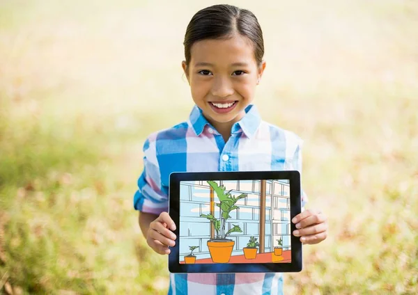 Мальчик, показаны в дом с планшета Стоковое Изображение